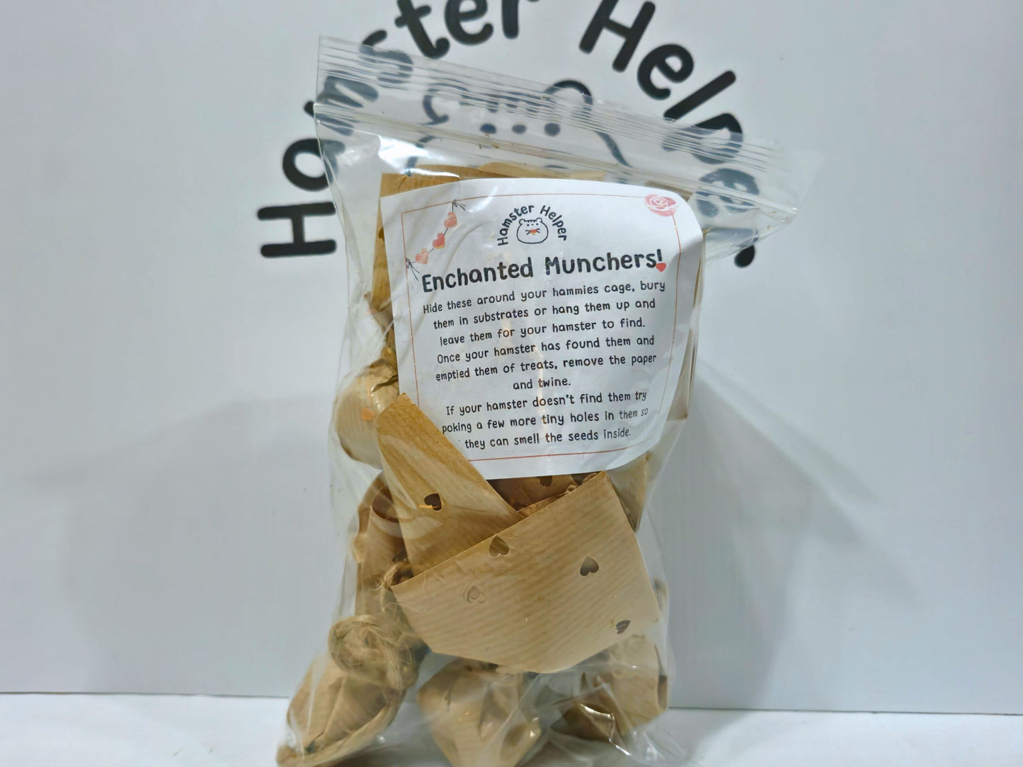 Packaged product labeled 'Enchanted Munchers' with a clear plastic cover on a white background.