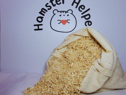 A cotton bag containing hamster safe aspen displayed in front of the Hamster Helper logo
