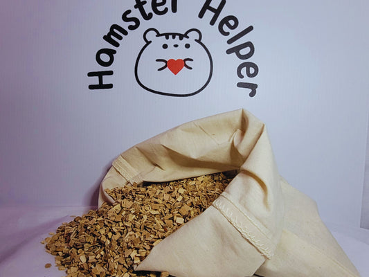 Fine grade hamster safe beech chips in a cotton bag in front of the Hamster Helper logo