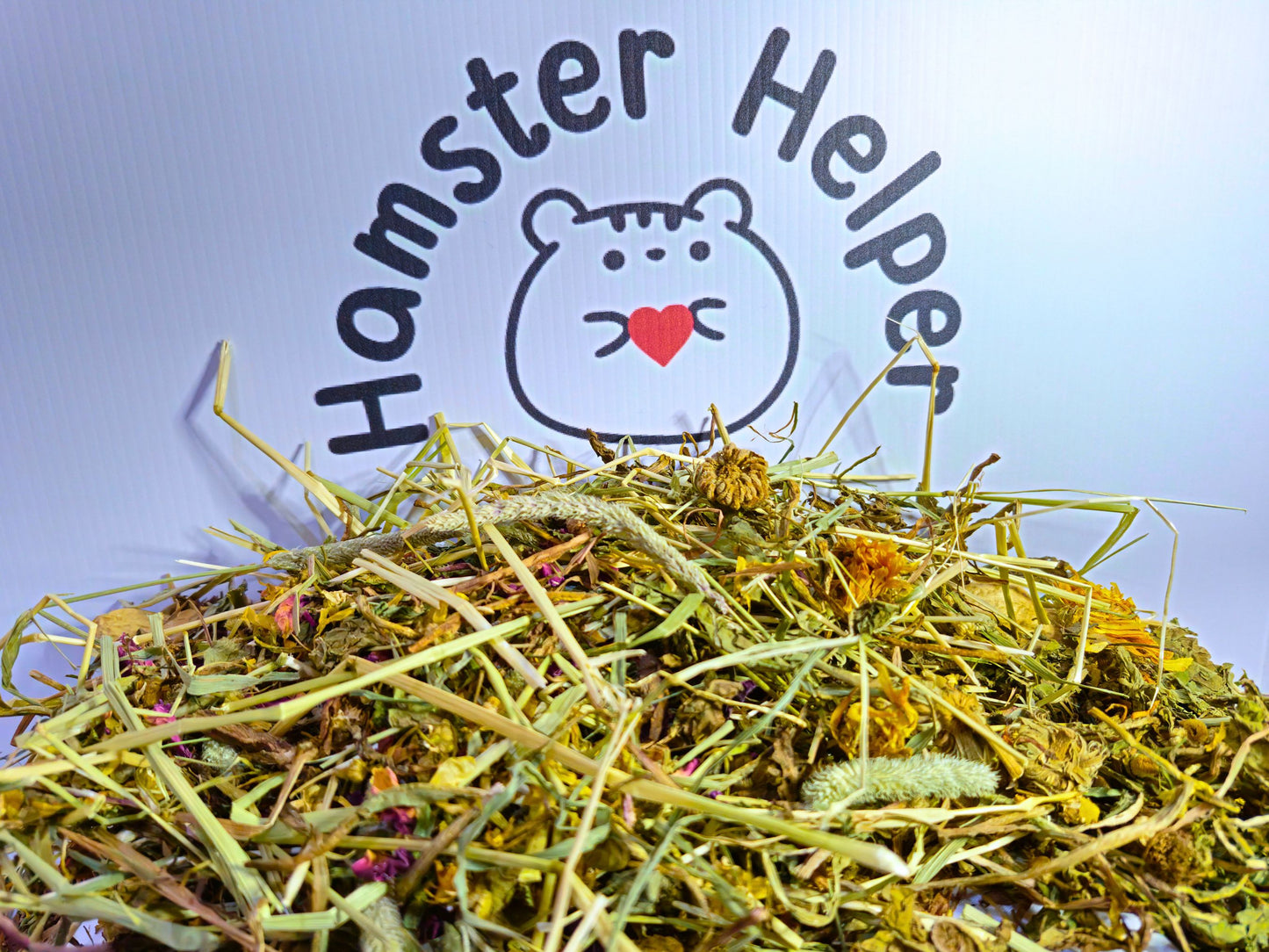 Hamster forest forage mix close up in front of the hamster helper logo.