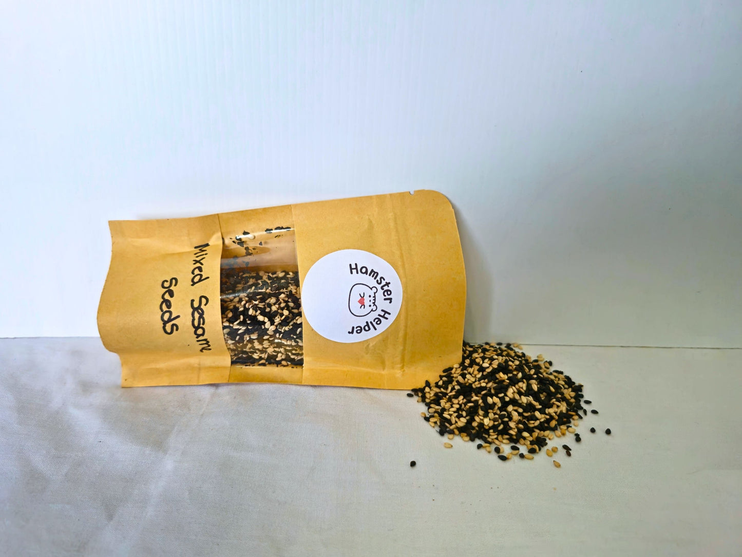 Sesame Seed Mix pouch with black and white seeds scattered beside it
