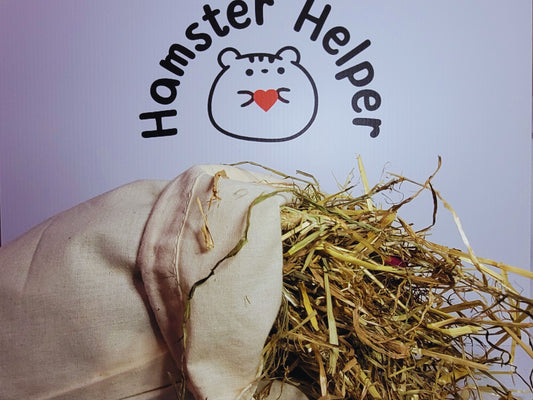 Hamster safe hay inside a cotton bag displayed in front of the Hamster Helper logo