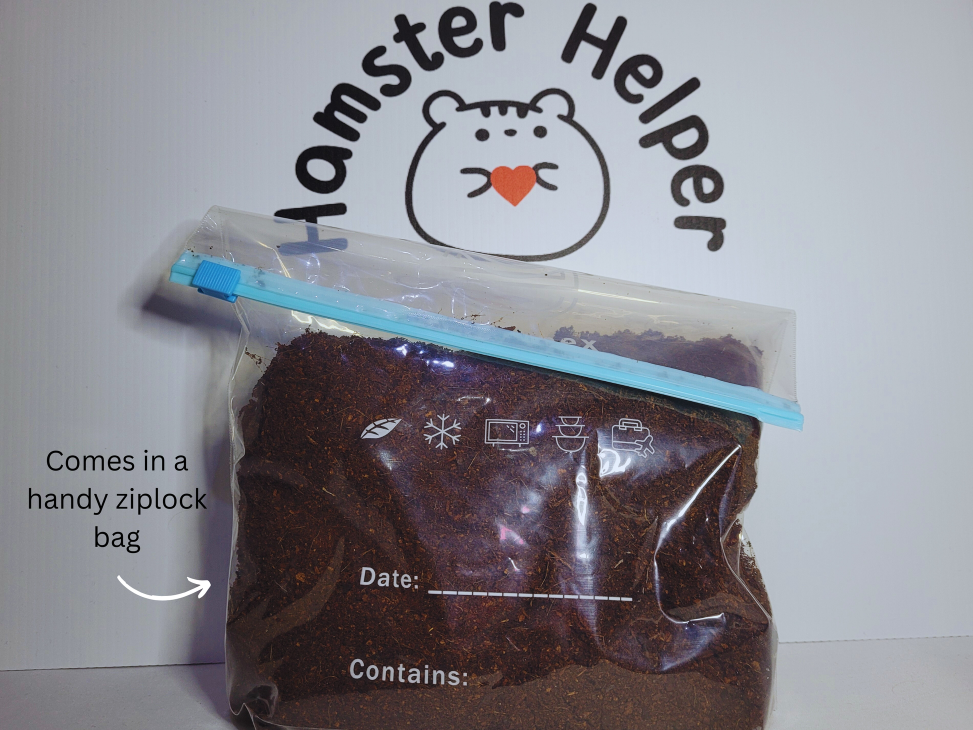 A ziplock bag containing hamster safe coco soil in front of the Hamster Helper logo