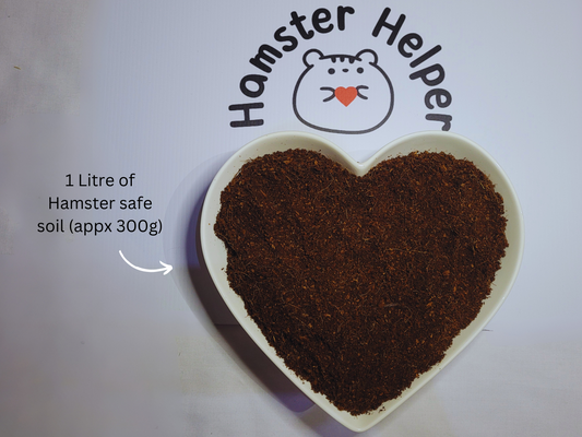 A heart shaped substrate bowl containing hamster safe coco soil underneath the hamster helper logo