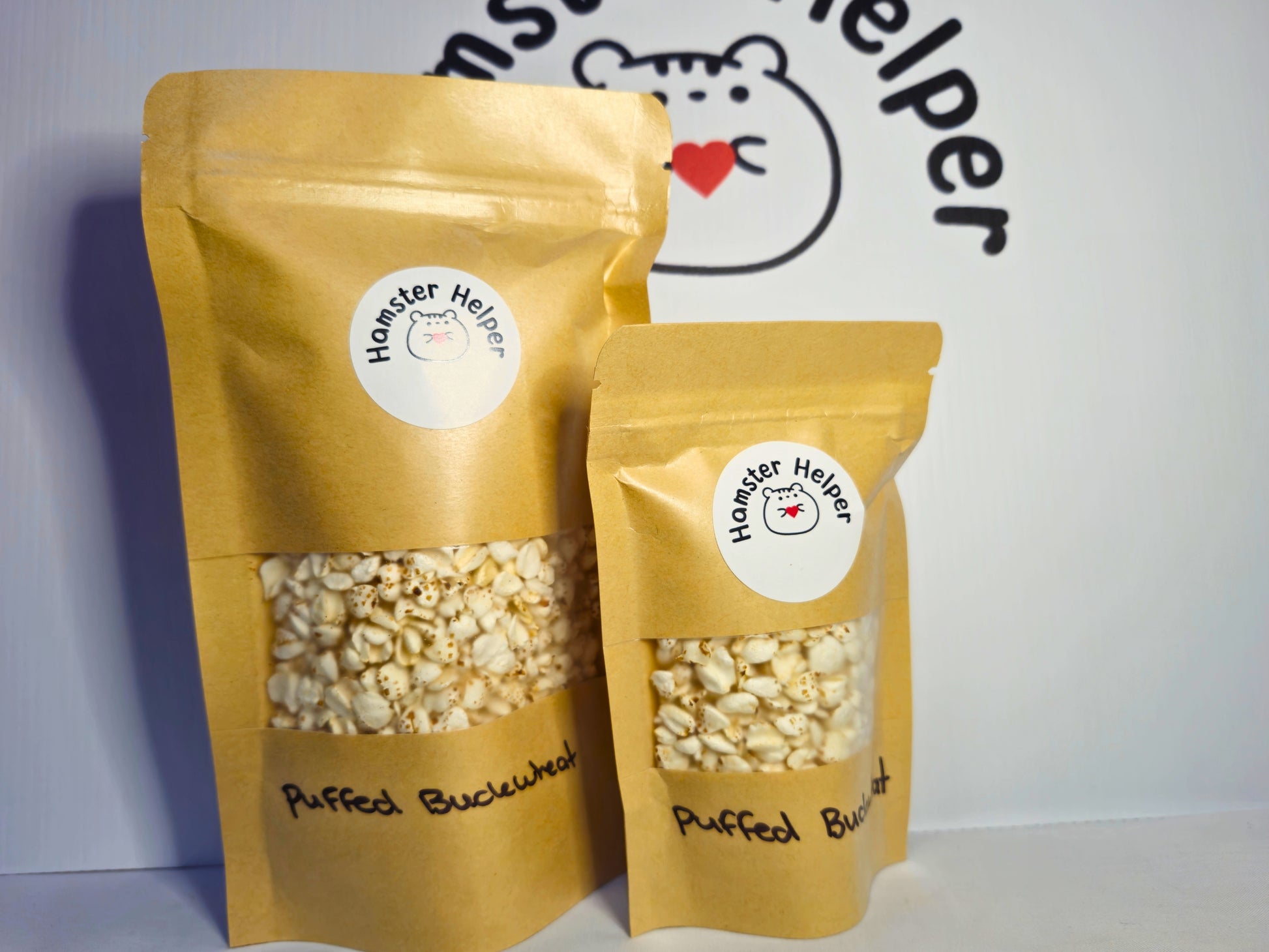 A large and small pouch of hamster safe organic puffed buckwheat