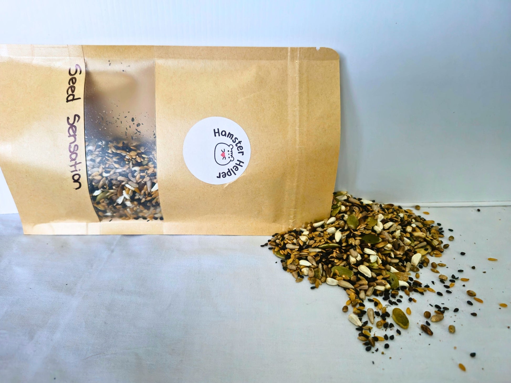 Seed Sensation pouch with the mixed seeds scattered beside it