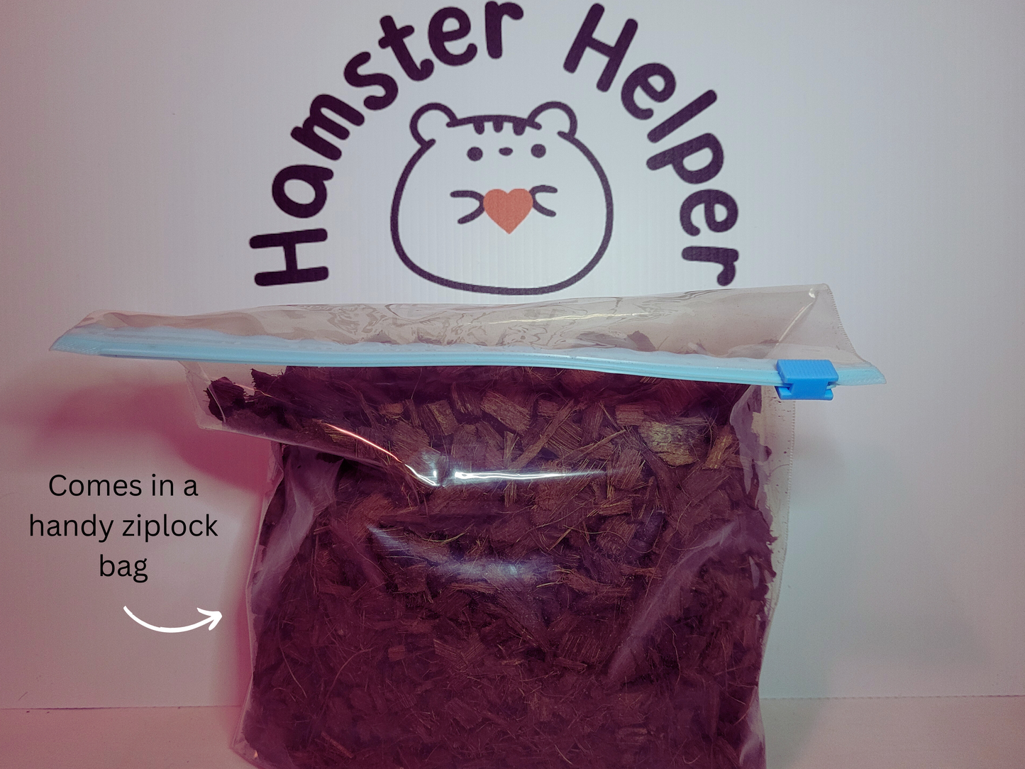 A ziplock bag containing hamster safe coco chips in front of the hamster helper logo