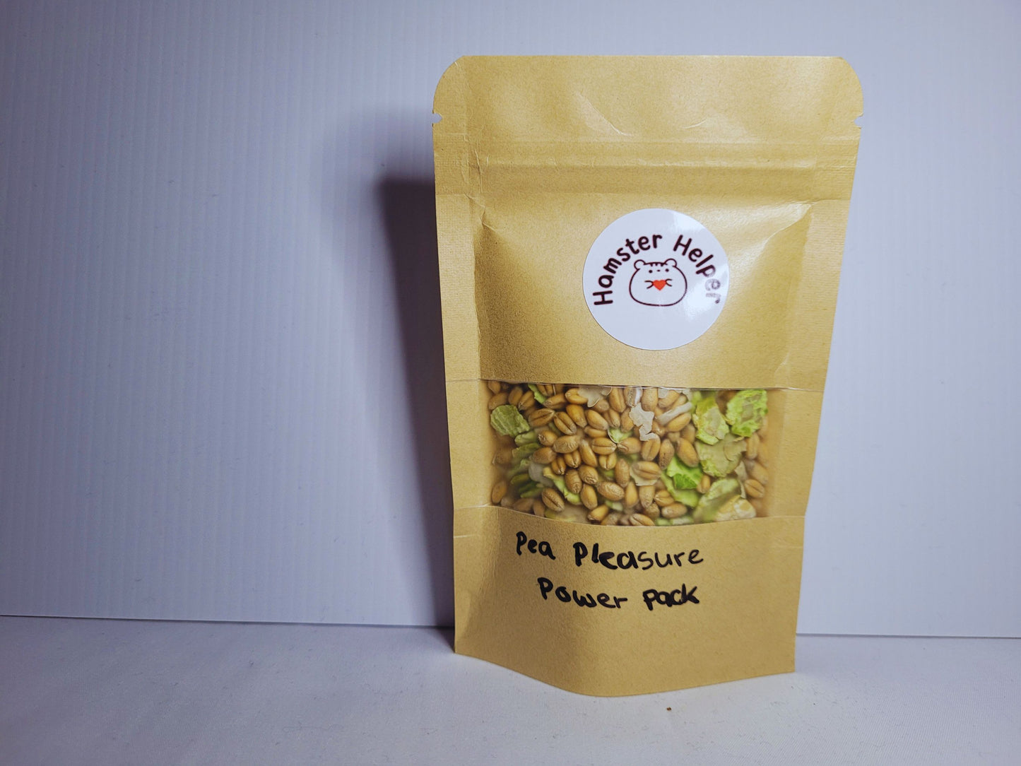 The pea pleasure power pack hamster treat mix in a pouch with the hamster helper logo.